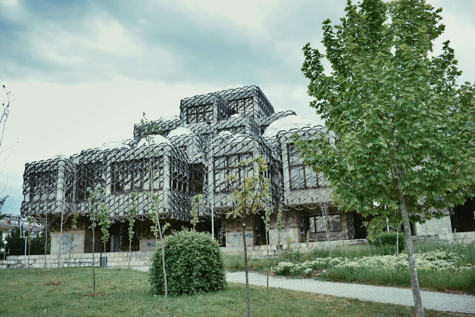 Facade of a building in Pristina covered in greenery